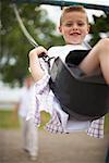 Boy Playing on Swings