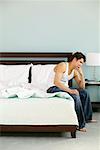 Man Thinking on Edge of Bed