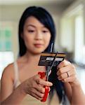 Woman Cutting Credit Card