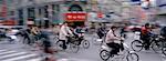 Cyclist Commuters in Street, Nanjing Road, Shanghai, China