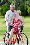 Couple Riding A Bicycle Together