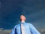 Businessman Meditating Outdoors