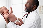 Doctor Holding Newborn