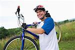 Man Carrying Bicycle