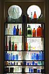 Bottle Collection in Front of Window