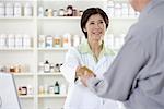 Pharmacist Helping Customer