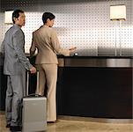 Couple at Front Desk in Hotel