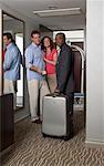 Bellhop Dropping off Couple's Luggage