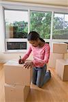 Woman Packing Boxes