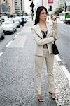 Businesswoman Standing on Road