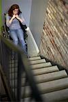 Girl in Wheelchair at Bottom of Stairs