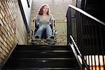 Girl in Wheelchair at Top of Stairs