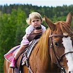Kind auf dem Pferd