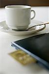 Coffee Cup and Cheque Book at Restaurant