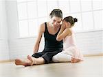 Ballet Student Whispering In Instructor's Ear