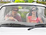 Couple in Car, Plants In Backseat