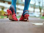 Woman with leaves stuck to her shoes