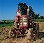 Gnome leaning on a tractor