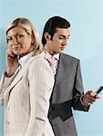 Portrait of Business People Using Cellular Telephones