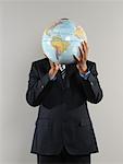 Businessman Holding Globe