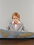 Portrait of Businesswoman Looking at Map