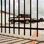 View of Parking Lot Through Fence