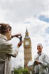 Woman Taking Picture of Man