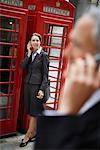 Business People Using Cellular Telephones, London, England