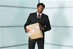 Businessman holding Box with Fragile Sticker on it