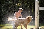 Teenager Washing Dog