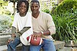 Portrait of Father and Son Sitting On Steps