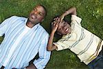 Father and Son Lying On The Grass