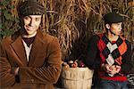 Portrait of Men With Basket of Apples