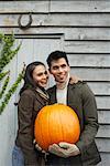 Portrait of Couple With Pumpkin