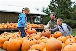 Family Choosing Pumpkin