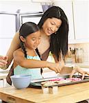 Woman and Girl Making Cookies