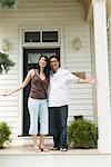 Portrait of Couple Outside of House