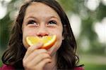 Girl Eating Orange