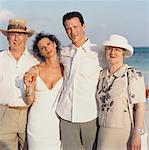 Bride and Groom with Parents on Beach