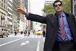 Businessman Hailing a Cab, New York, New York, USA