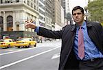 Businessman Hailing a Cab, New York, New York, USA