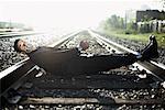 Businessman Tied to Train Tracks