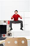 Businessman Jumping in Air