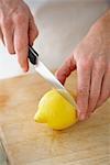 Woman Cutting Lemon