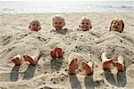 Children Buried in Sand