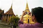 Woman Taking Picture of the Grand Palace, Bangkok, Thailand