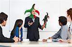 Businessman Holding Meeting in Jester Costume