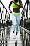 Woman Jogging Across Bridge