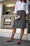 Businesswoman Using Bank Machine