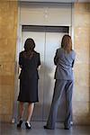 Businesswomen Waiting for Elevator